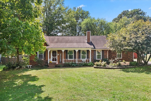 view of front of property with a porch and a front lawn