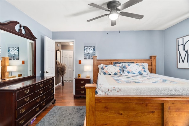 bedroom with ceiling fan and dark hardwood / wood-style flooring