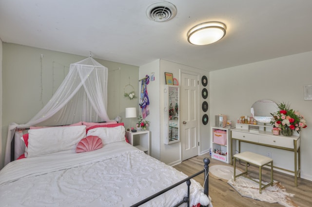 bedroom with light hardwood / wood-style flooring