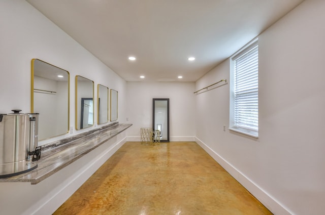 corridor with concrete floors