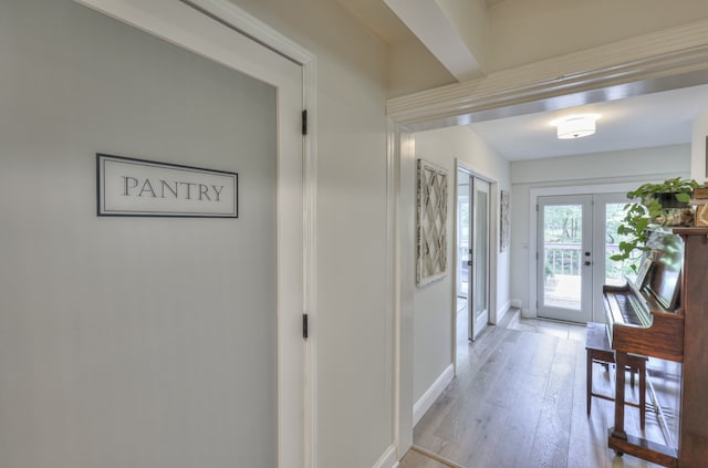 interior space with light hardwood / wood-style floors and french doors