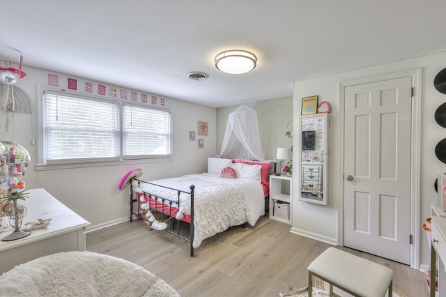 bedroom featuring light hardwood / wood-style floors