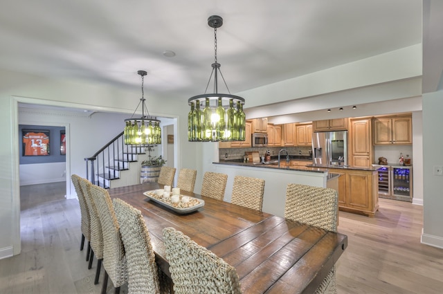 dining room with a chandelier and light hardwood / wood-style floors