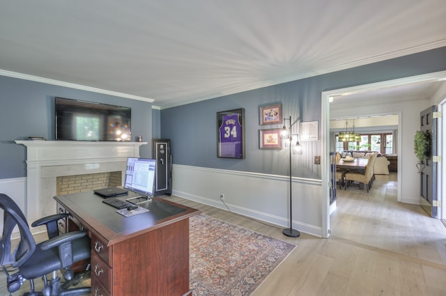 office featuring light wood-type flooring and crown molding