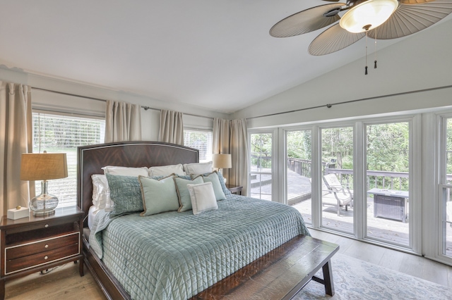 bedroom with access to outside, multiple windows, light hardwood / wood-style flooring, and lofted ceiling