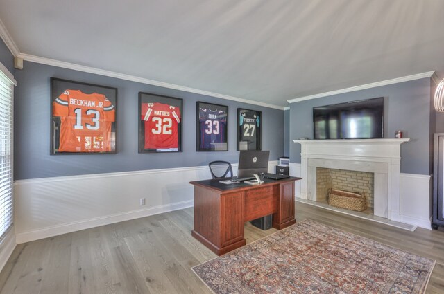 home office with crown molding and light wood-type flooring