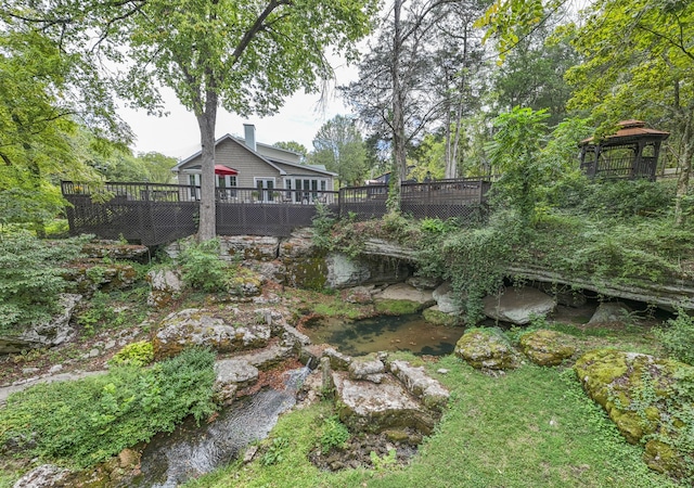 view of yard featuring a wooden deck