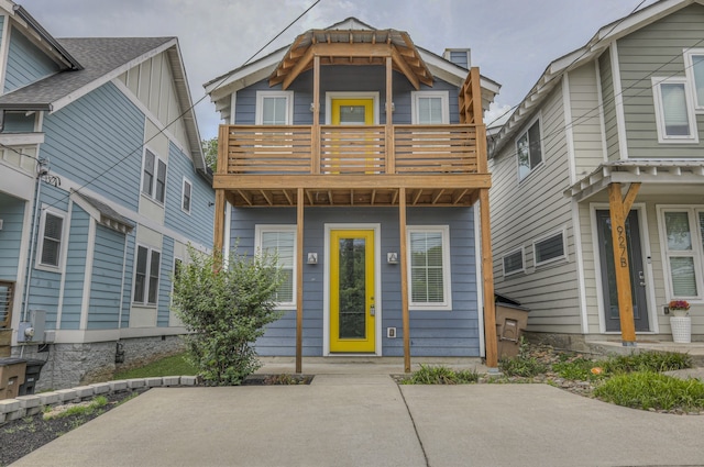 view of front of home with a balcony