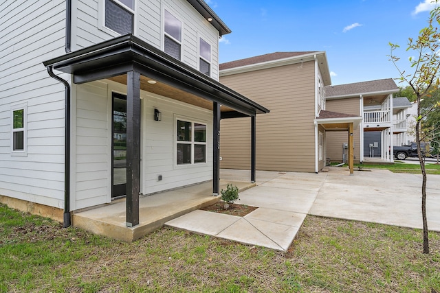 rear view of property featuring a balcony