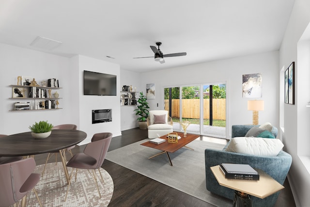 living room with ceiling fan and dark wood-type flooring