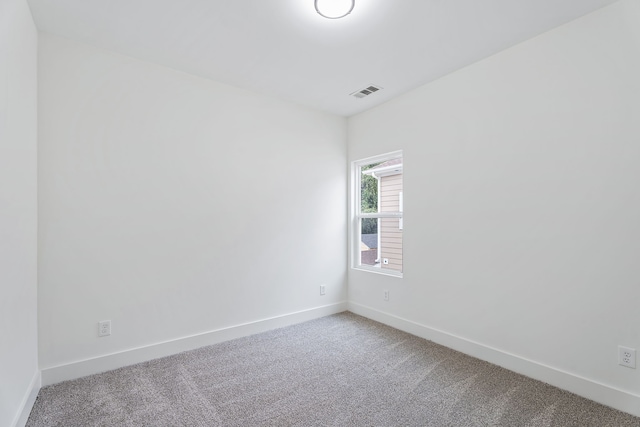 empty room with carpet flooring