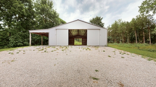 view of outbuilding with a carport