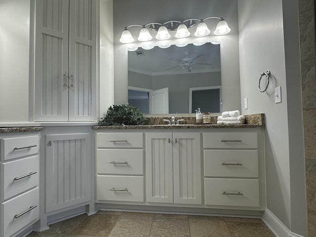 bathroom featuring crown molding, vanity, and ceiling fan