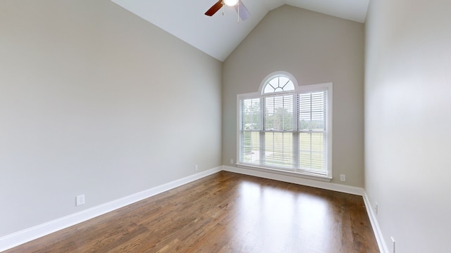 spare room featuring ceiling fan, a healthy amount of sunlight, and dark hardwood / wood-style flooring