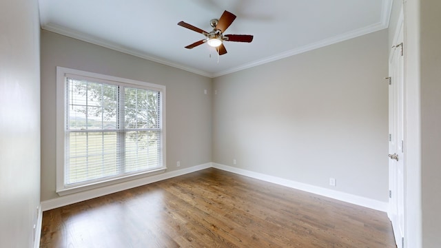 empty room with ornamental molding, ceiling fan, and hardwood / wood-style flooring