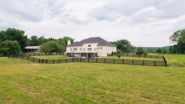 view of yard with a rural view