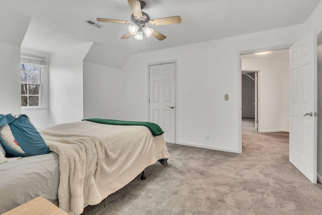 carpeted bedroom featuring vaulted ceiling and ceiling fan