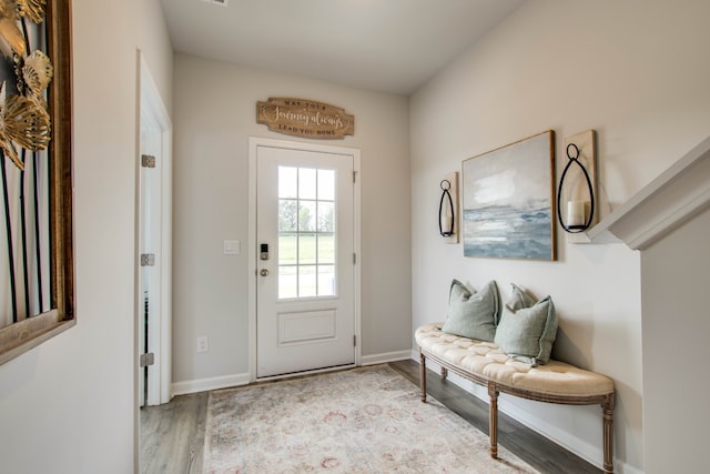 entryway with light hardwood / wood-style flooring