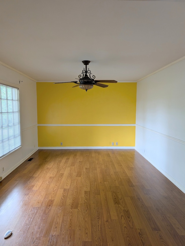 spare room with ceiling fan, light hardwood / wood-style flooring, and ornamental molding