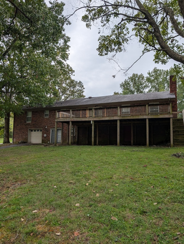 back of property featuring a wooden deck and a yard