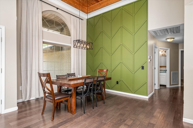 dining space with dark wood-type flooring