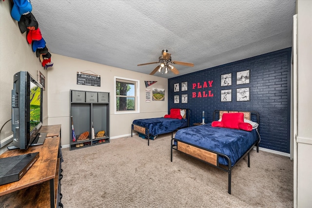 bedroom featuring carpet floors, a textured ceiling, and ceiling fan