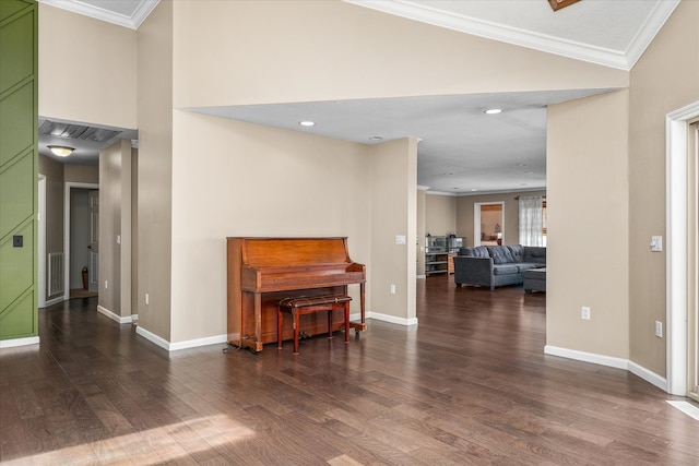 interior space with ornamental molding and dark hardwood / wood-style floors