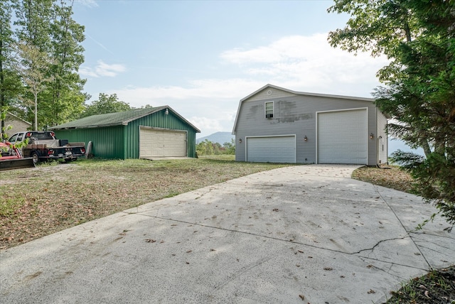 exterior space with an outbuilding and a garage