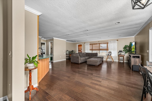 living room featuring ornamental molding, a textured ceiling, and dark wood-type flooring