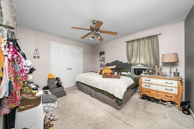 bedroom with ceiling fan, a closet, and carpet flooring