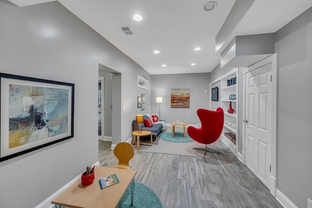 sitting room featuring light hardwood / wood-style floors