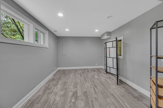 spare room with light hardwood / wood-style flooring