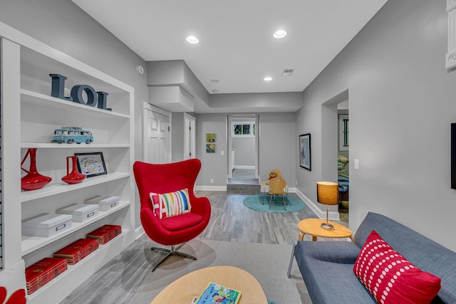 living area with hardwood / wood-style flooring