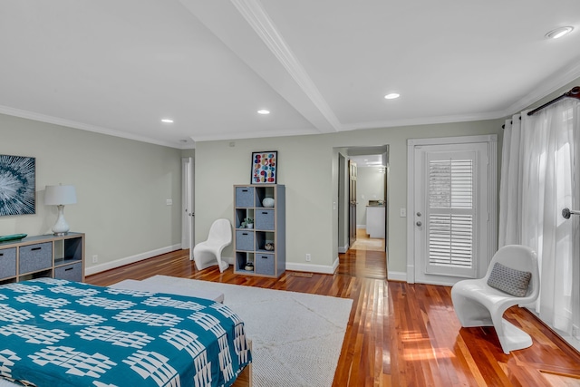 bedroom with ornamental molding, beam ceiling, and hardwood / wood-style flooring