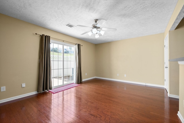 spare room with a textured ceiling, hardwood / wood-style floors, and ceiling fan