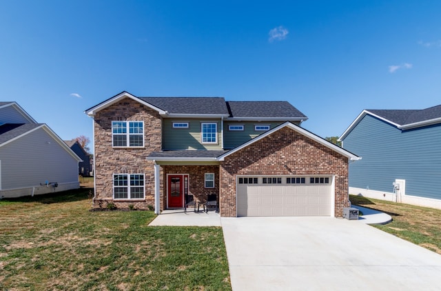 view of front of home featuring a garage and a front yard