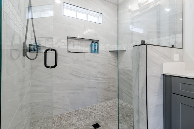 bathroom with vanity and walk in shower