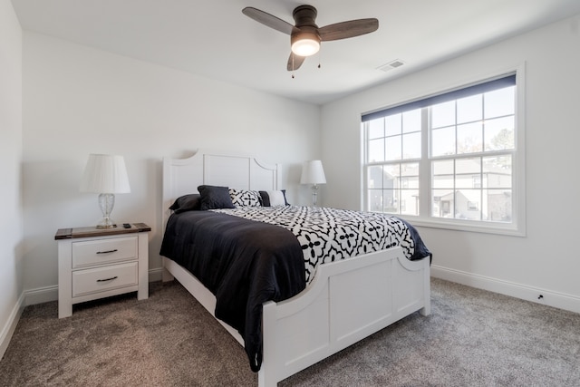 bedroom featuring ceiling fan and carpet