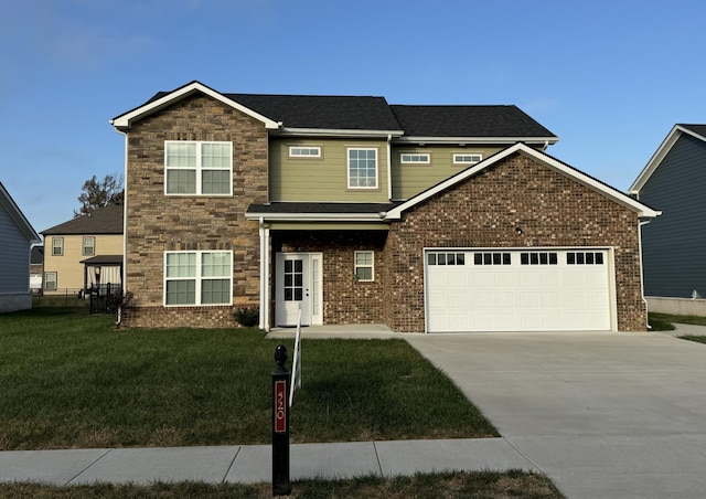 view of front of property featuring a garage and a front yard