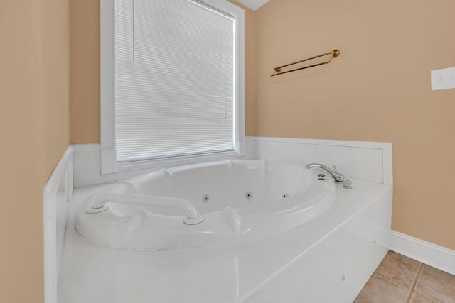 bathroom with tile patterned floors and a bathing tub