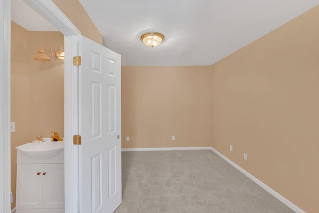 empty room with light colored carpet