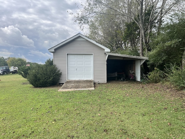 garage featuring a yard