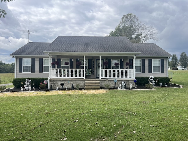 ranch-style home with a front lawn and a porch