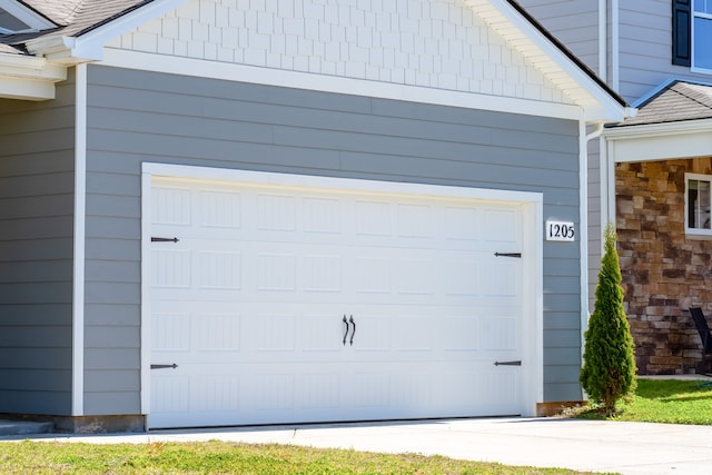 garage featuring wooden walls