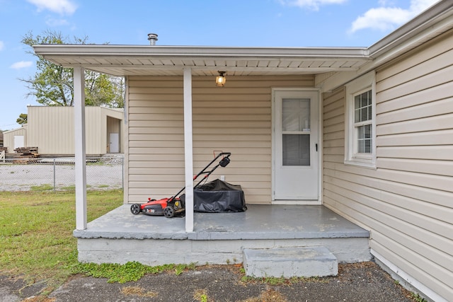 property entrance with a yard