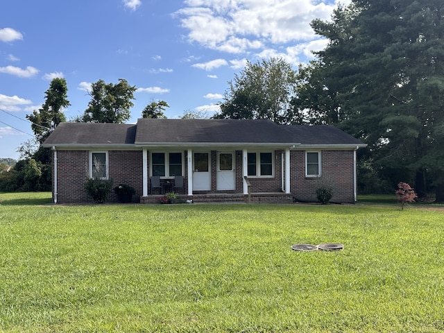 ranch-style house with a front lawn and a porch