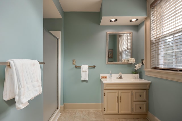 bathroom featuring vanity, tile patterned floors, and an enclosed shower