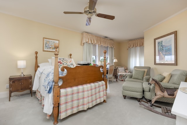 bedroom featuring carpet floors, ornamental molding, and ceiling fan