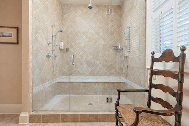 bathroom featuring a shower with door and tile patterned floors