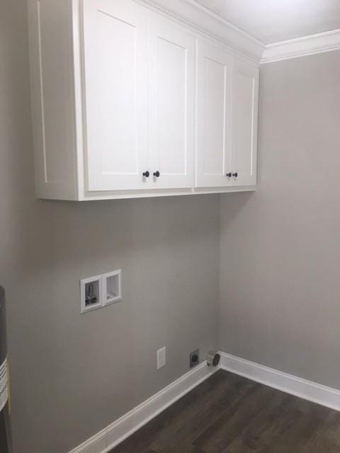 washroom with dark hardwood / wood-style flooring, cabinets, crown molding, and washer hookup